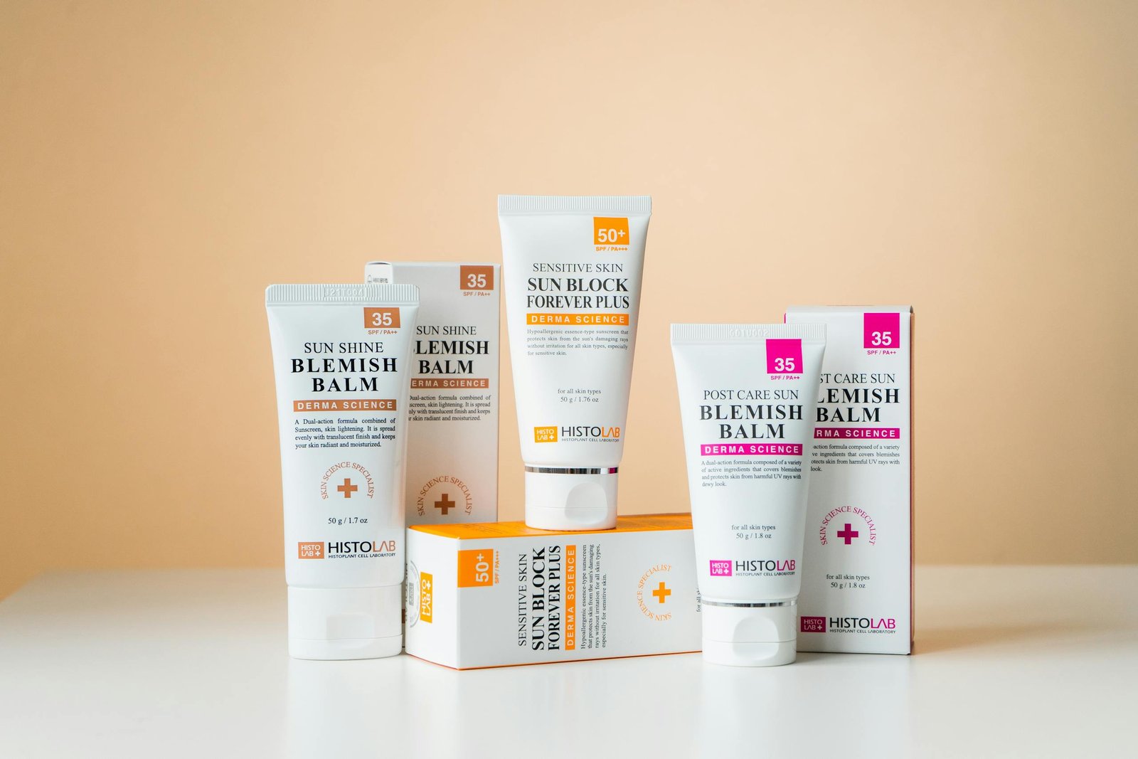 Studio shot of Histolab skincare products with yellow background.